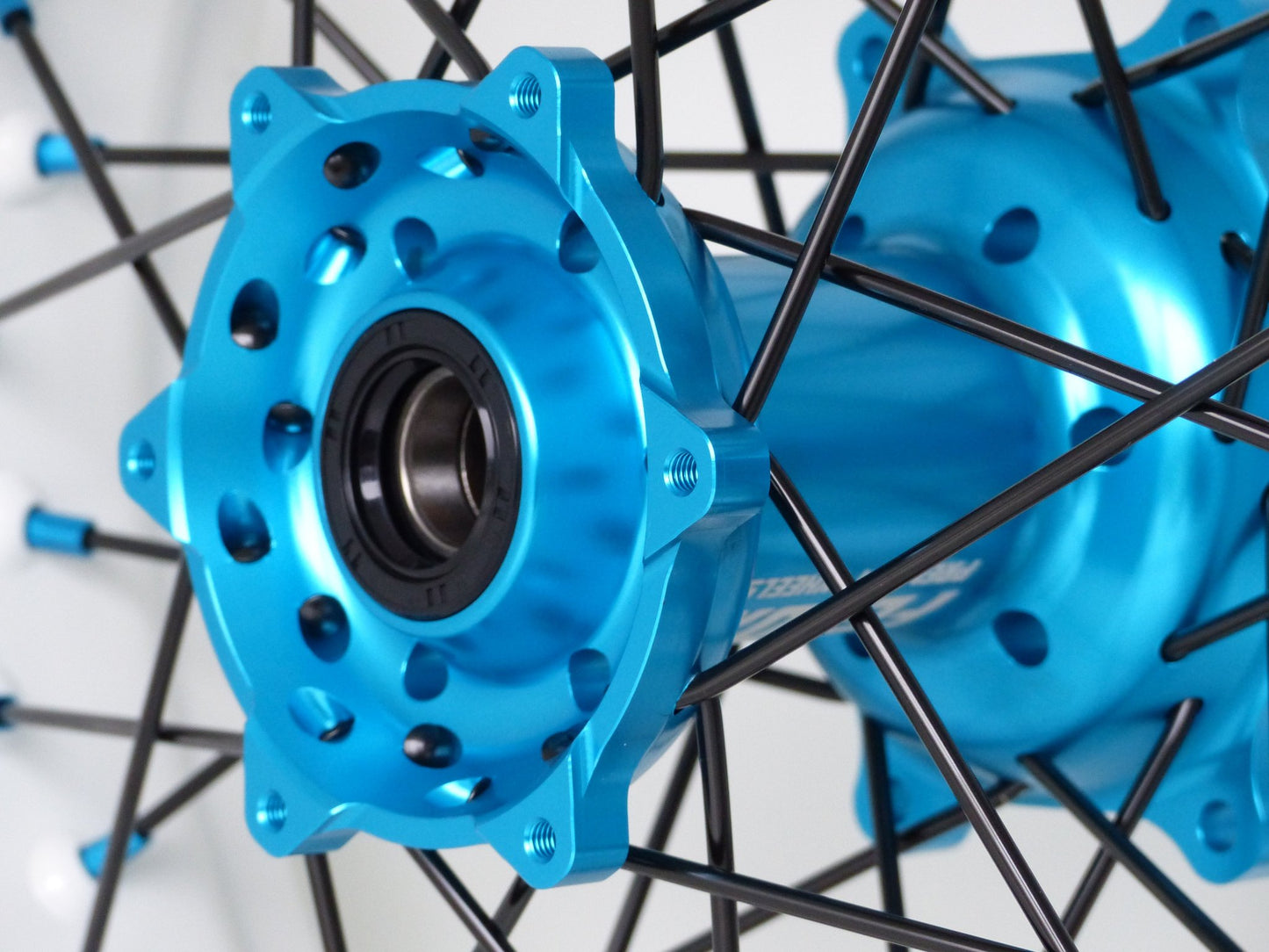 White rim, Black spokes, Light Blue nipples, Light Blue hub