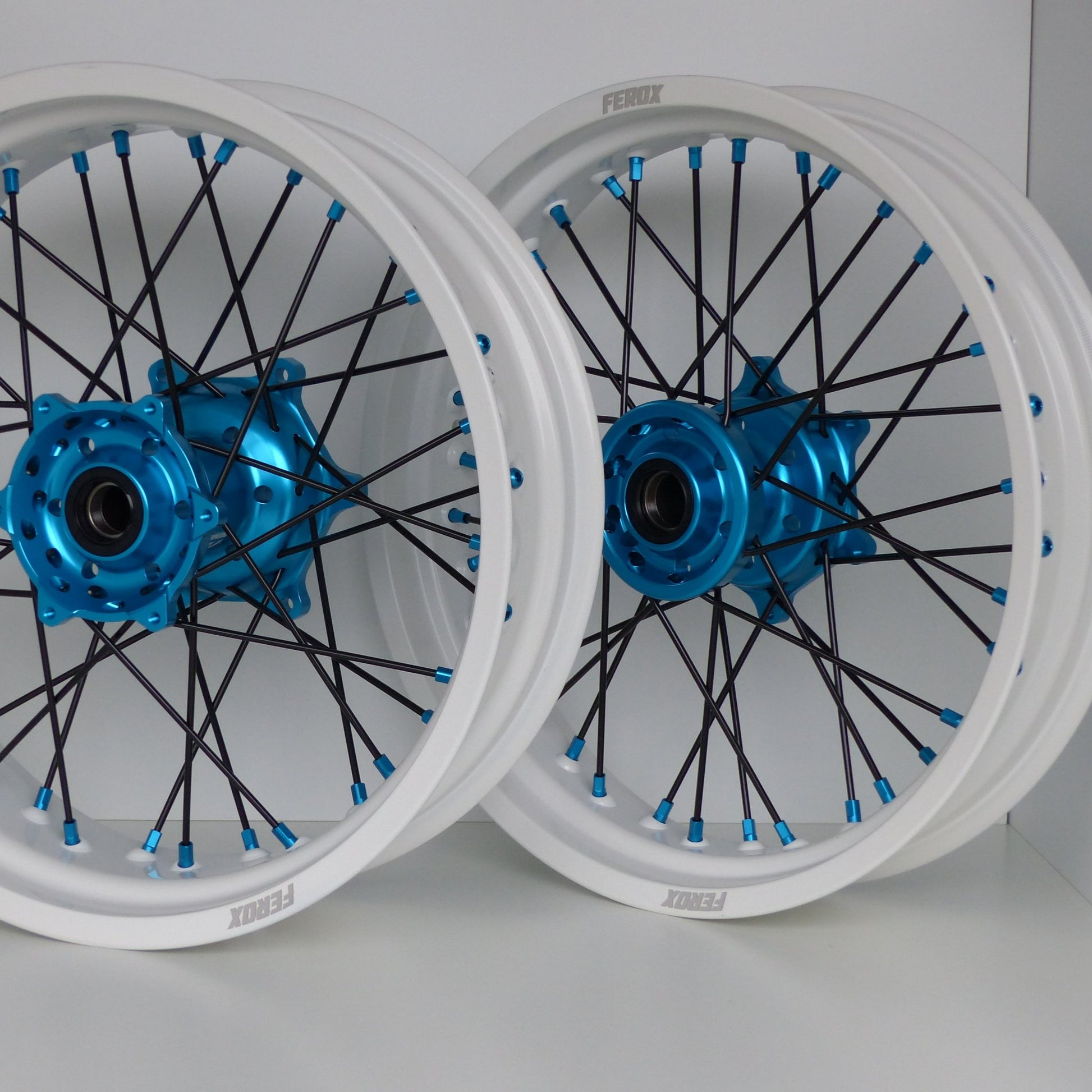 White rim, Black spokes, Light Blue nipples, Light Blue hub
